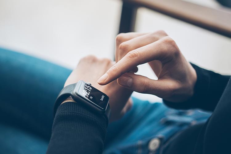 Hands using a smart watch Hands using a smart watch